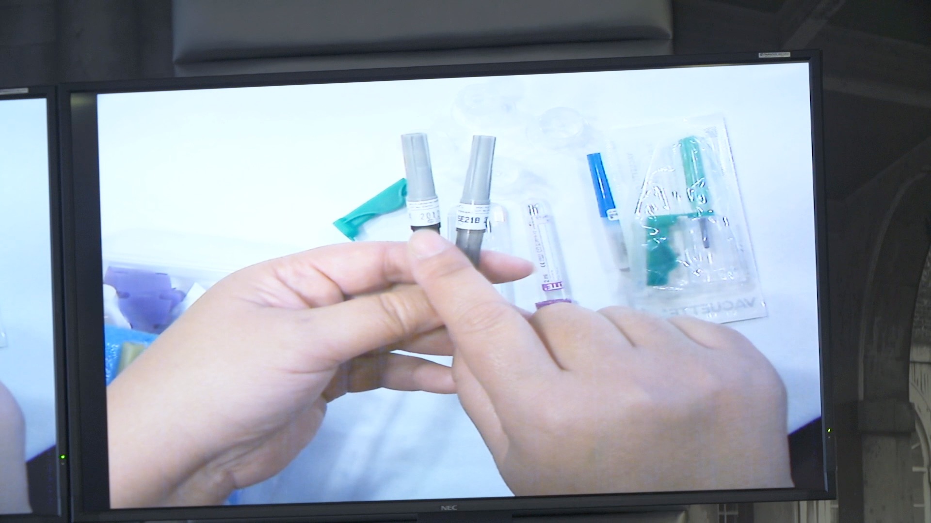 A VeinTrain educator demonstrating clinical equipment during a learning session